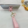 Cartoon character keychains, creative phone stands, car key pendants, cute couple bags and accessories details Picture